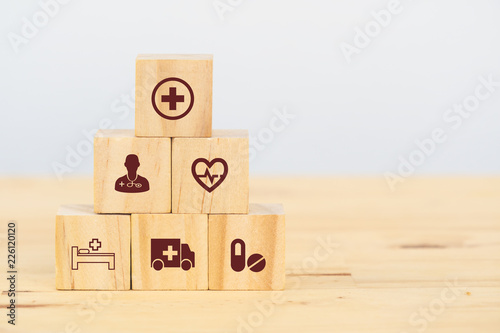 Obraz na plátně smart health care, insurance concept, wooden cube symbolize insurance to protect