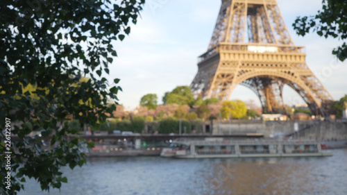 Photography Blurred view of Eiffel Tower landmark in Paris across the River Seine