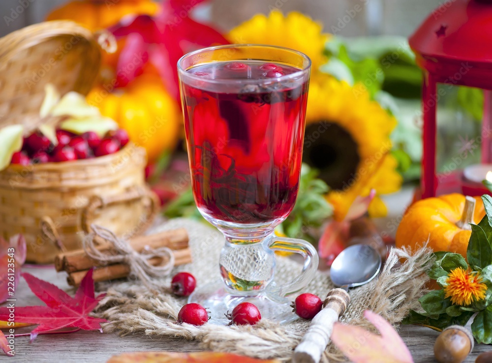 hot winter or autumn drink with spices and wild rose berries, mulled wine, hot wine