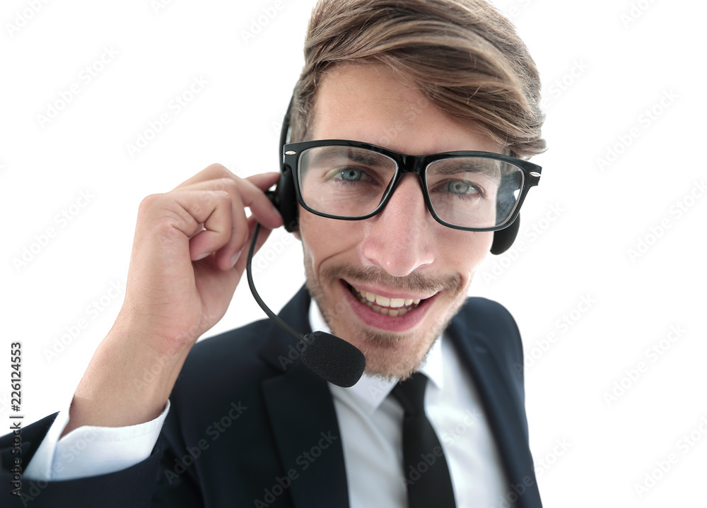 Smiling businessman talking on headset against a white backgroun