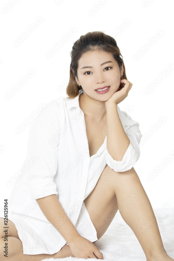 Sexy Asian woman wearing a white shirt on white backround Sexy Asian woman wearing a white shirt on white backround