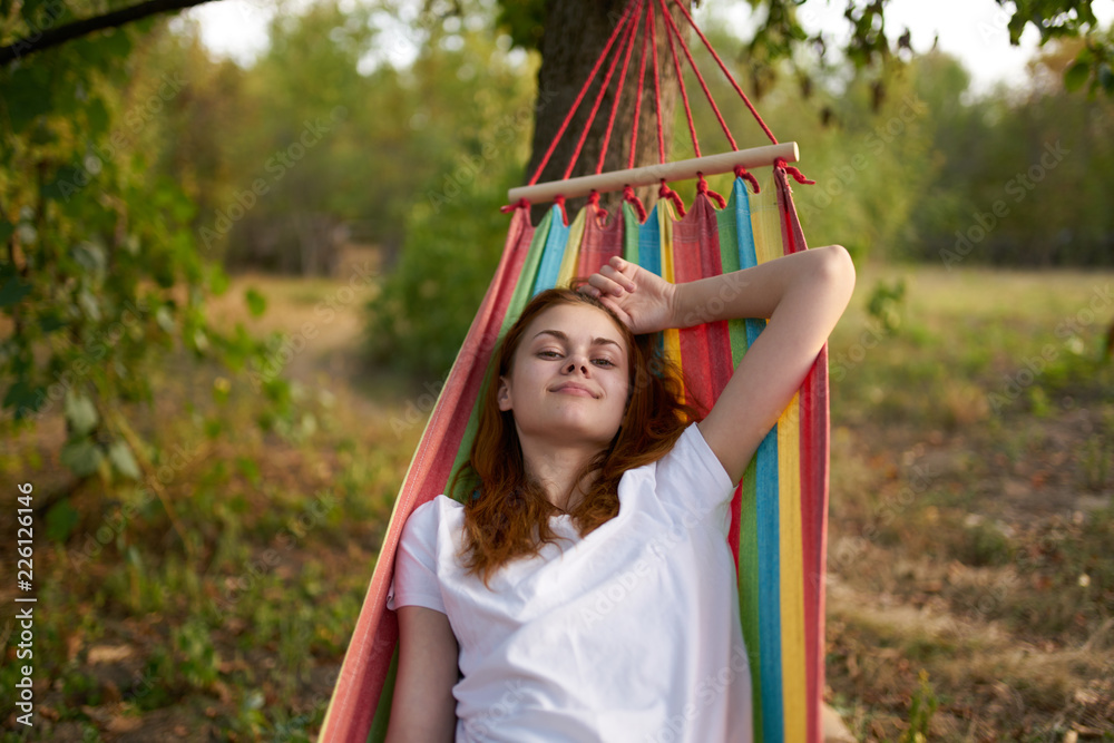 woman resting on a hammock in the country woman resting on a hammock in the country