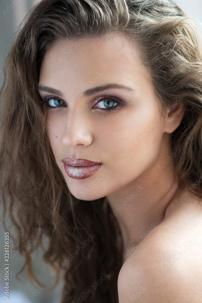 Beauty young woman with sparkle eye and lip make up and long hair. Beauty young woman with sparkle eye and lip make up and long hair.