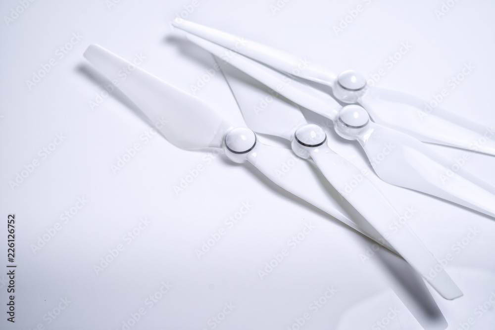 A white drone propeller arm with a rigid type of propeller forward on white isolated background A white drone propeller arm with a rigid type of propeller forward on white isolated background