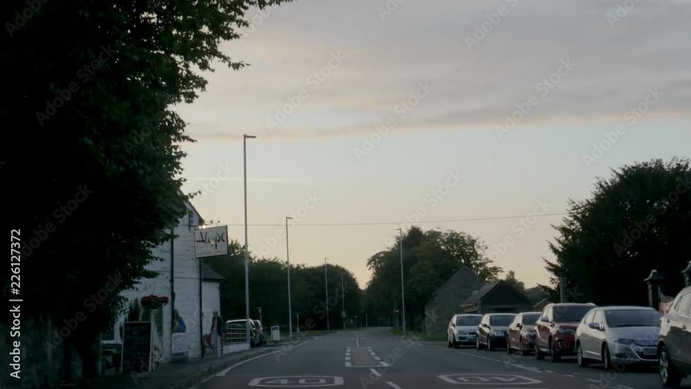 POV-Drive plate-Driving through the village of Carno a village in Powys, Wales at sunset. It is at the geographical center of Wales POV-Drive plate-Driving through the village of Carno a village in Powys, Wales at sunset. It is at the geographical center of Wales
