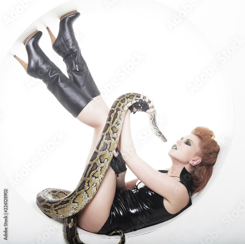 woman with creative make up holding Python