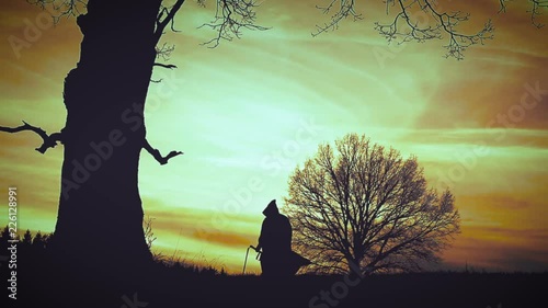 At sunset there is a grim Reaper photo