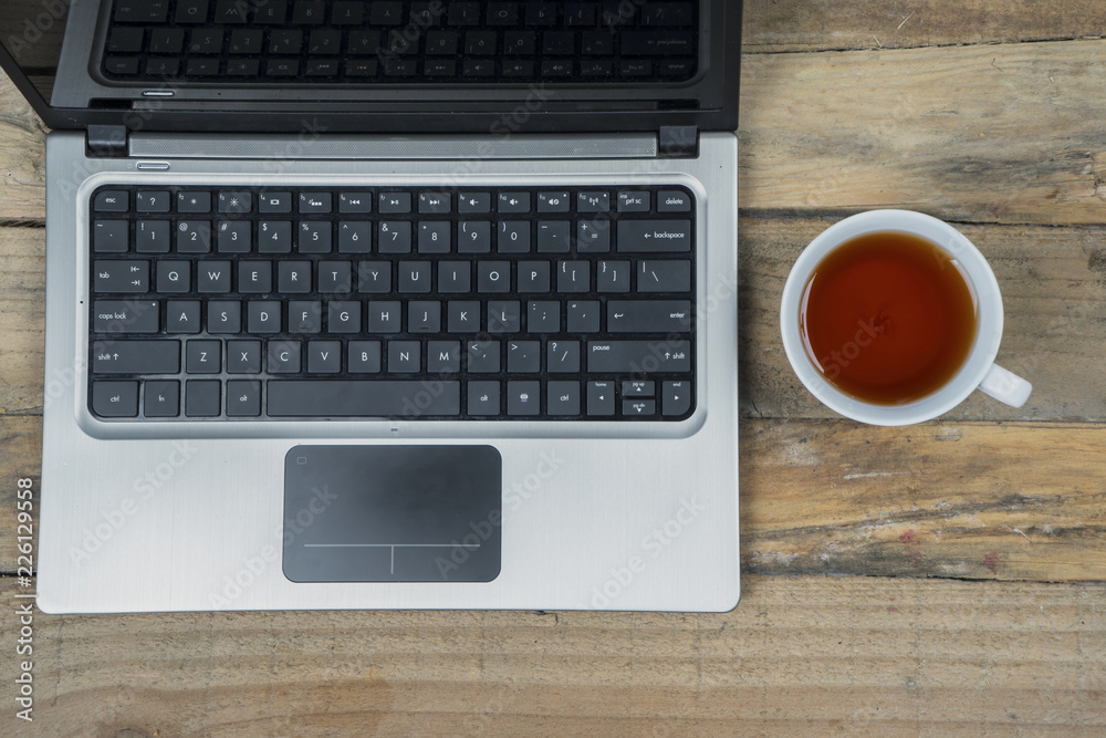 Computer laptop with cup of tea Computer laptop with cup of tea