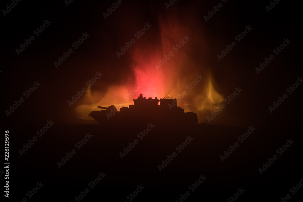 Sea battle scene. Silhouette of military war ship on dark foggy toned sky background. Explosion and fire. Dramatic scene decoration.