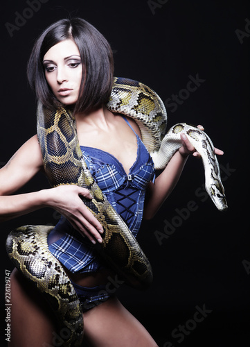 sexy brunette holding python