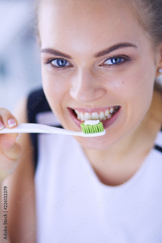 Young pretty girl maintaining oral hygiene with toothbrush. Young pretty girl maintaining oral hygiene with toothbrush.