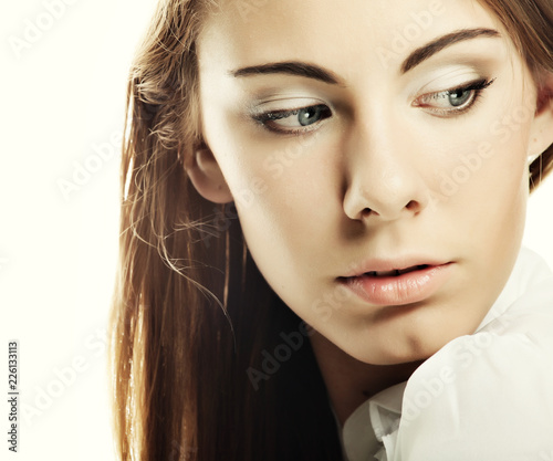 Face of a sexy beautiful young woman with clean skin on a white 