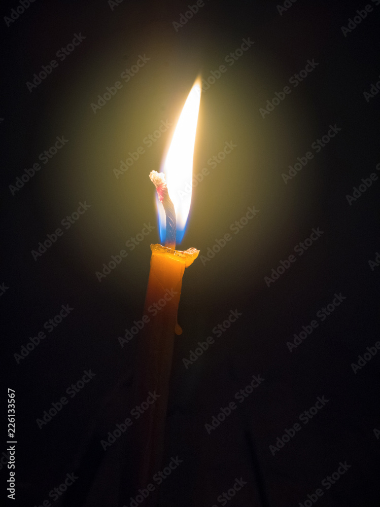 Candle flame close up on a black background Candle flame close up on a black background
