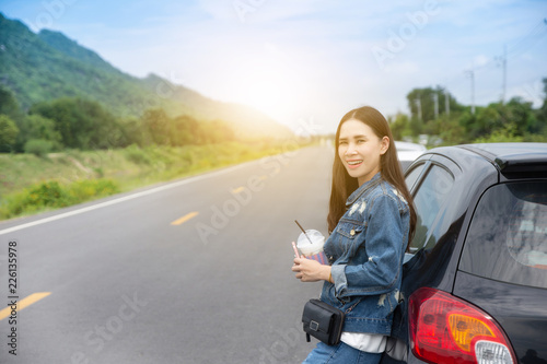 Women with Car parked on road and Small passenger car seat on the road used for daily trips