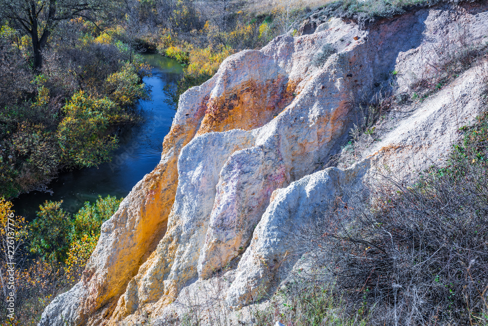 The output of limy rocks of organic origin near the river. Western Siberia, Russia The output of limy rocks of organic origin near the river. Western Siberia, Russia