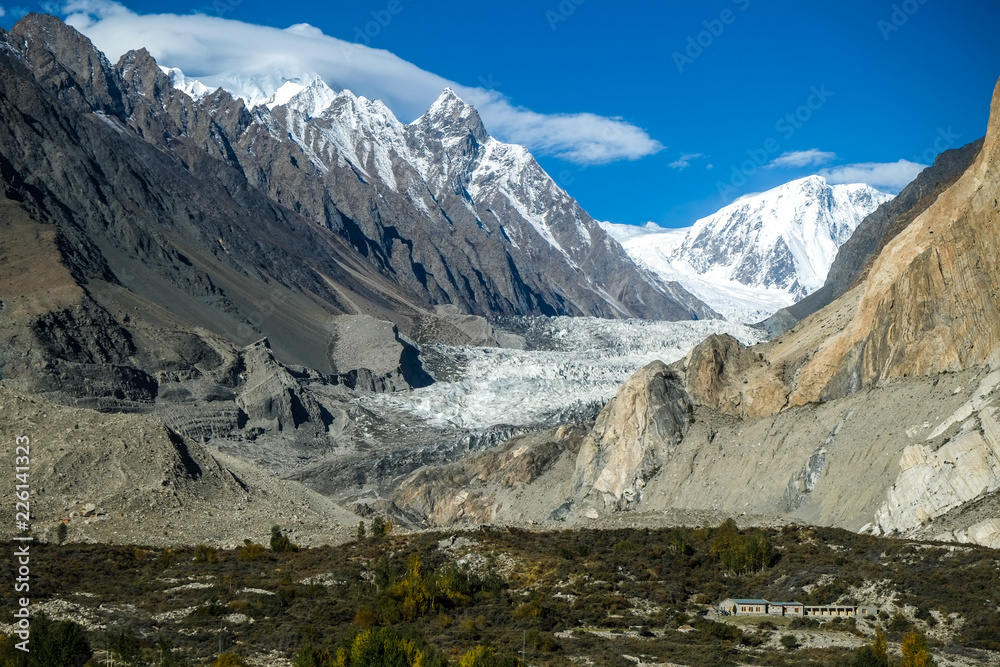 Passu glacier surrounded by snow capped mountains in Karakoram range. Gojal valley. Gilgit Baltistan, Pakistan.