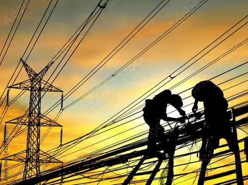 Silhouette electricians on wooden staircase are working to connect telephone and cable lines with high voltage pole and blur sunrise sky background, illustration mode