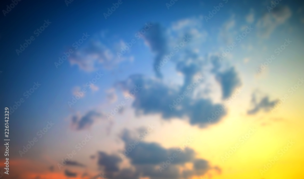 Amazing beautiful sunset and clouds at twilight sky background. defocused image. blur effect