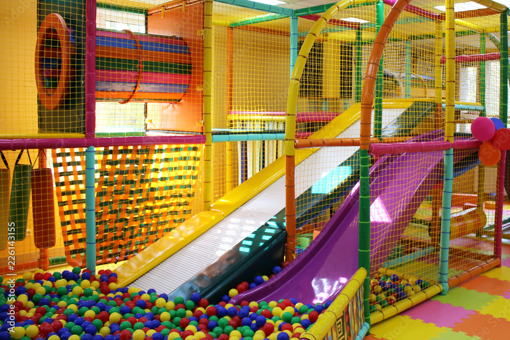 three multi-colored plastic slides in the children's play complex, slide down, entertainment for children, concept