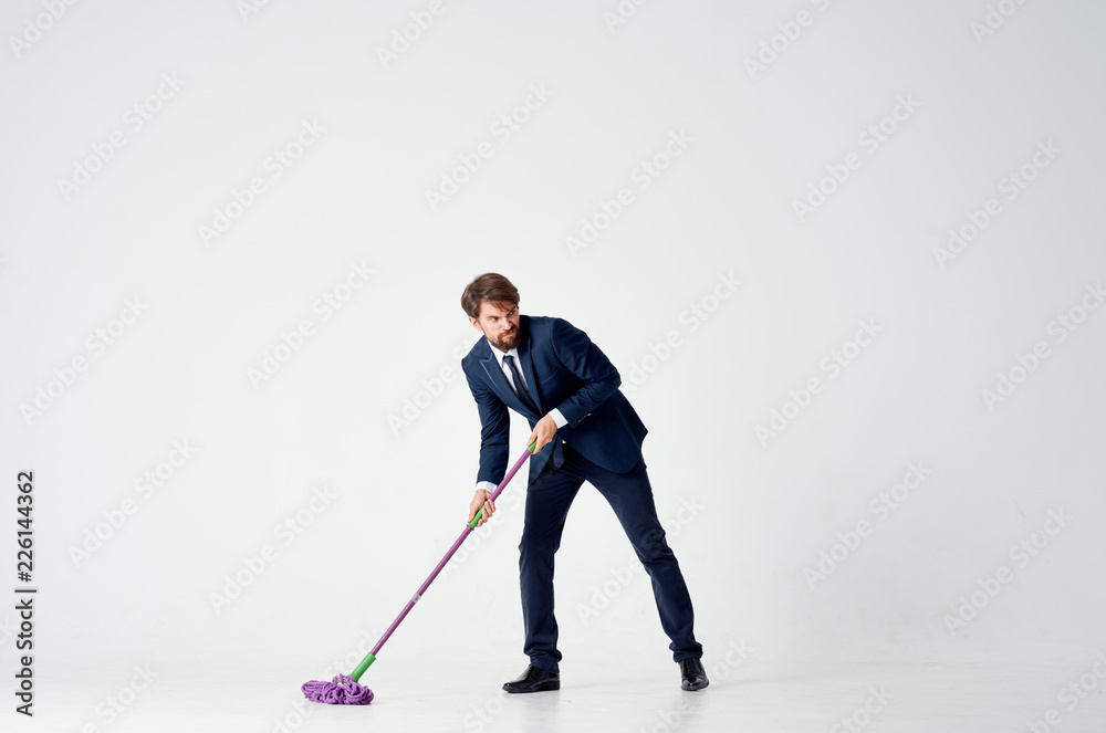 angry business man mopping floors on isolated background