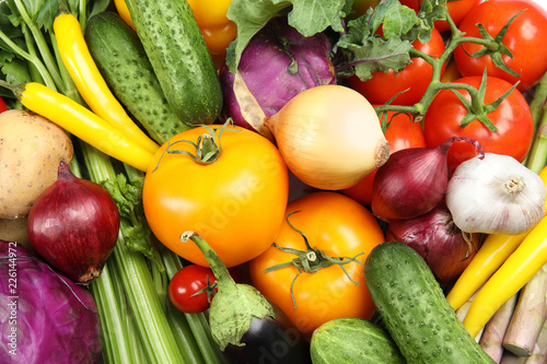 Many fresh ripe vegetables as background. Organic food