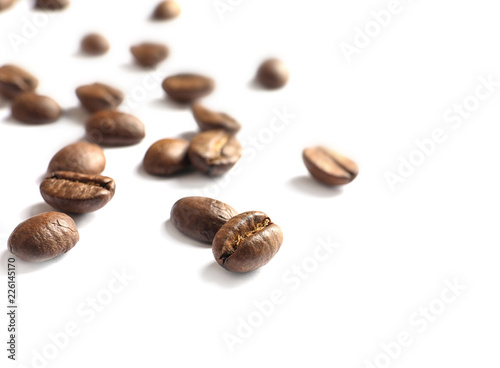 Roasted coffee beans on white background, closeup