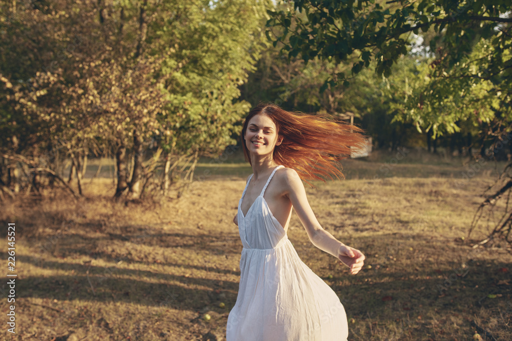 happy woman smiling running around in the garden summer nature clean air happy woman smiling running around in the garden summer nature clean air