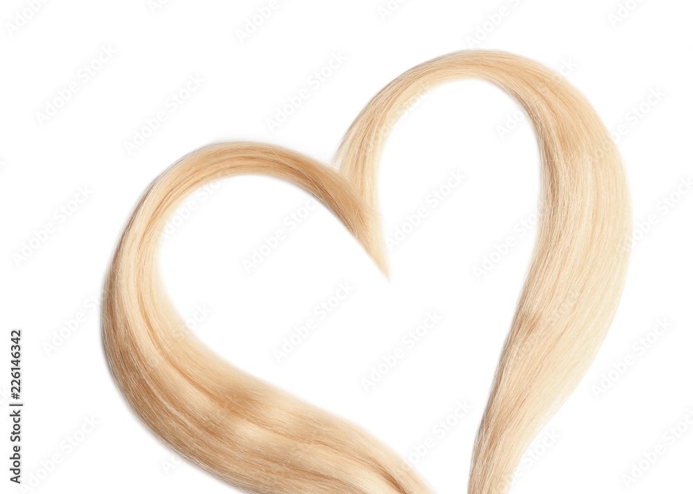 Heart made of blond hair locks on white background