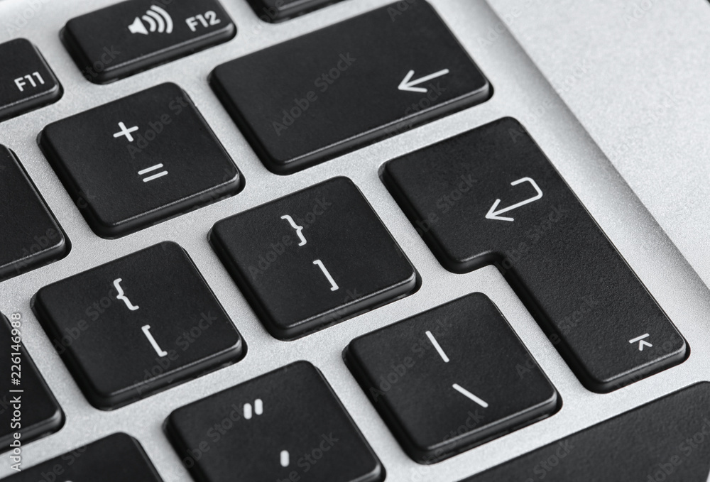 Modern laptop keyboard with black buttons, closeup view Modern laptop keyboard with black buttons, closeup view