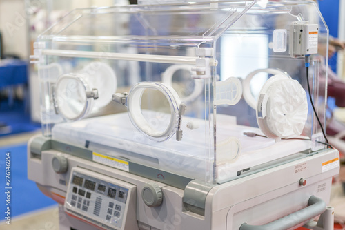 Empty infant incubator in an hospital room. Nursery incubator in hospital photo
