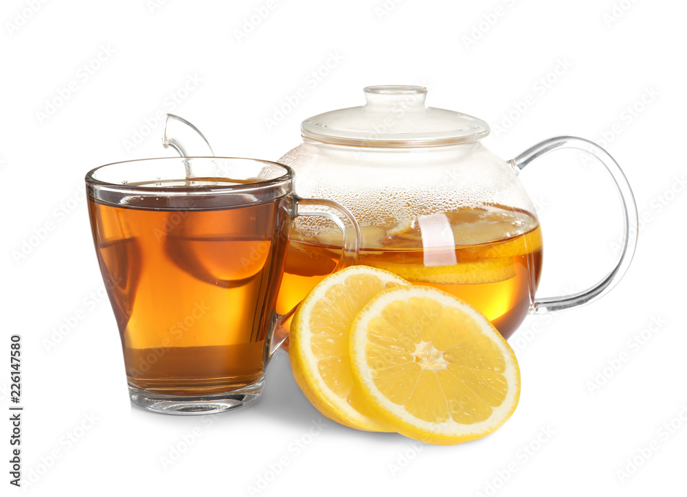 Cup and teapot with lemon tea on white background Cup and teapot with lemon tea on white background