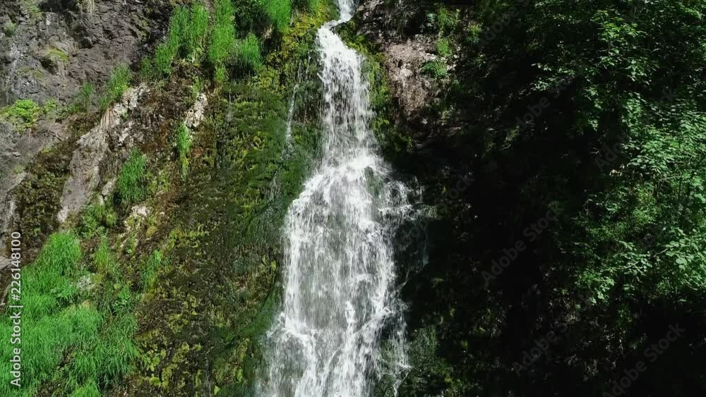 Waterfall in the forest Panoramic aerial view. Summer weather, taiga nature, Russia, Siberia. Waterfall in the forest Panoramic aerial view. Summer weather, taiga nature, Russia, Siberia.