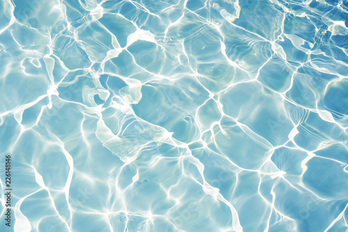 Surface of blue water in swimming pool texture background