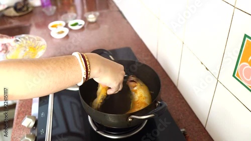 Indian women frying fish photo
