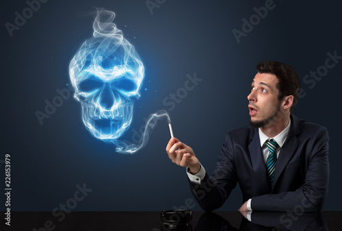 Businessman smoking with skull simbol above his head.