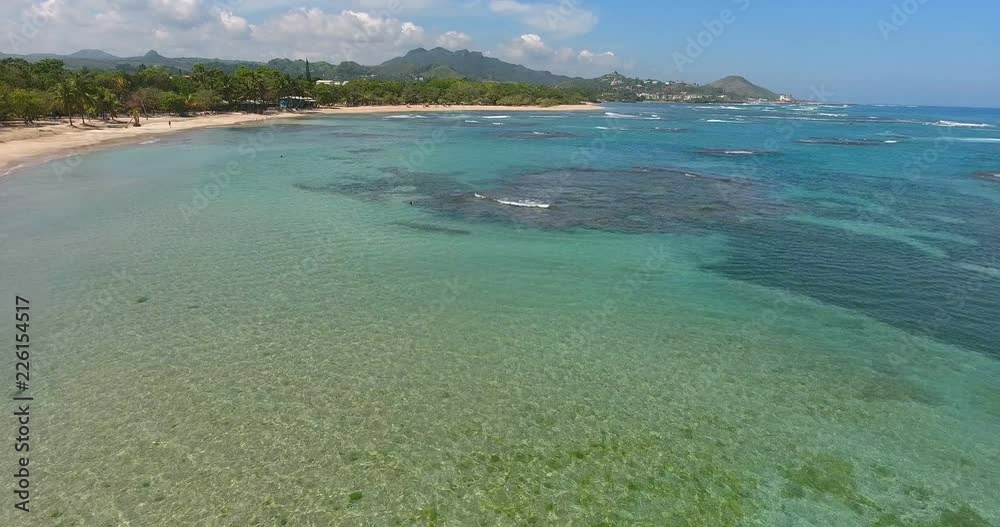 Beautiful pacific island. Sea waves in Atlantic ocean. Aerial drone bird's eye view video on turquoise water. Top view. Shot in 4k Beautiful pacific island. Sea waves in Atlantic ocean. Aerial drone bird's eye view video on turquoise water. Top view. Shot in 4k