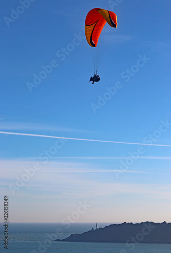 Tandem paraglider above Start Bay