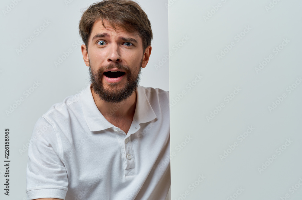 business man with a beard with emotions on his face on a light background business man with a beard with emotions on his face on a light background