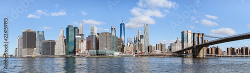 skyline of lower Manhattan and Brooklyn bridge with panoramic view on the buildings, monuments and skyscrapers
