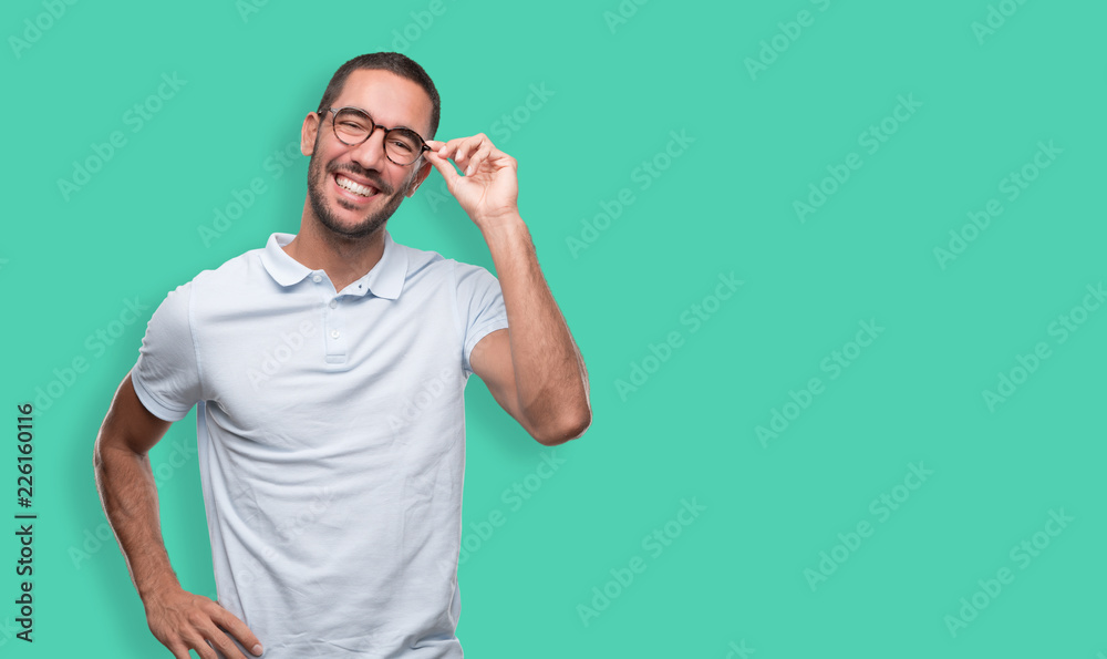 Satisfied young man smiling Satisfied young man smiling