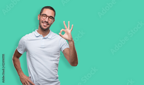 Happy young man doing a gesture of approval