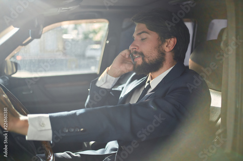 business success career business man talking on the phone going behind the wheel