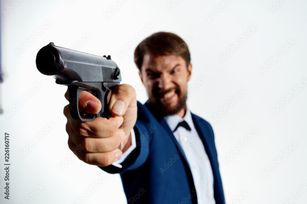 angry dangerous man with a beard holding a gun angry dangerous man with a beard holding a gun