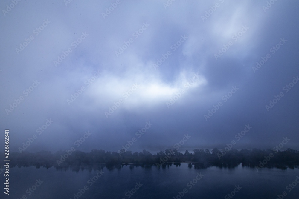 Fog on the river, ominous evening, background Fog on the river, ominous evening, background