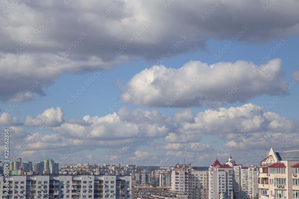 URBANIZATION with clouds, cityscape, clouds, background URBANIZATION with clouds, cityscape, clouds, background