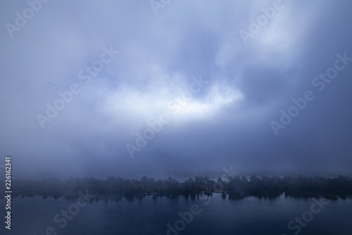 Fog on the river, ominous evening, background