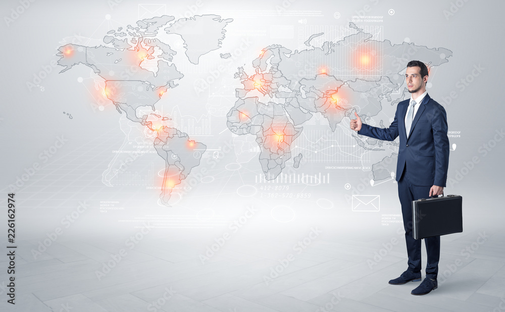 Businessman in dark suit hitchhike to business trip in a front of a map with destination Businessman in dark suit hitchhike to business trip in a front of a map with destination