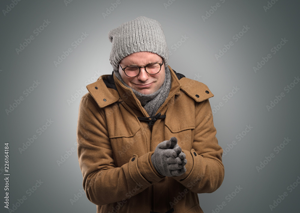 Handsome young boy freezing in warm clothing with copy space Handsome young boy freezing in warm clothing with copy space