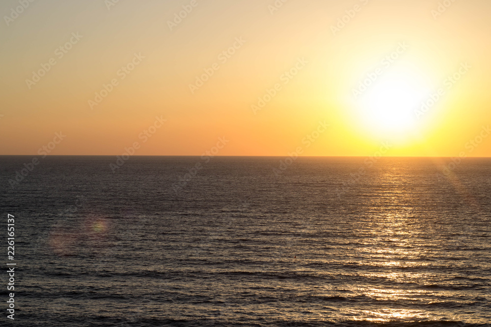 Beautiful bright sunset on the sea coast