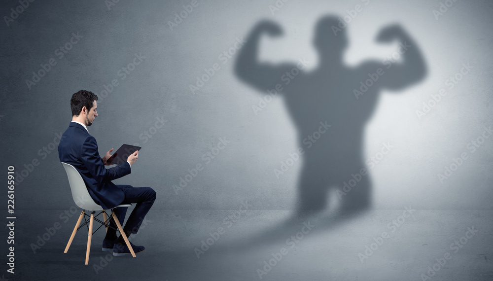 Businessman staying and offering stuffs to a shadow businessman
Businessman staying and offering stuffs to a shadow businessman